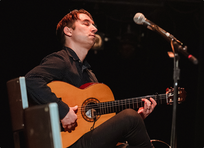 Jed Miley playing flamenco guitar
